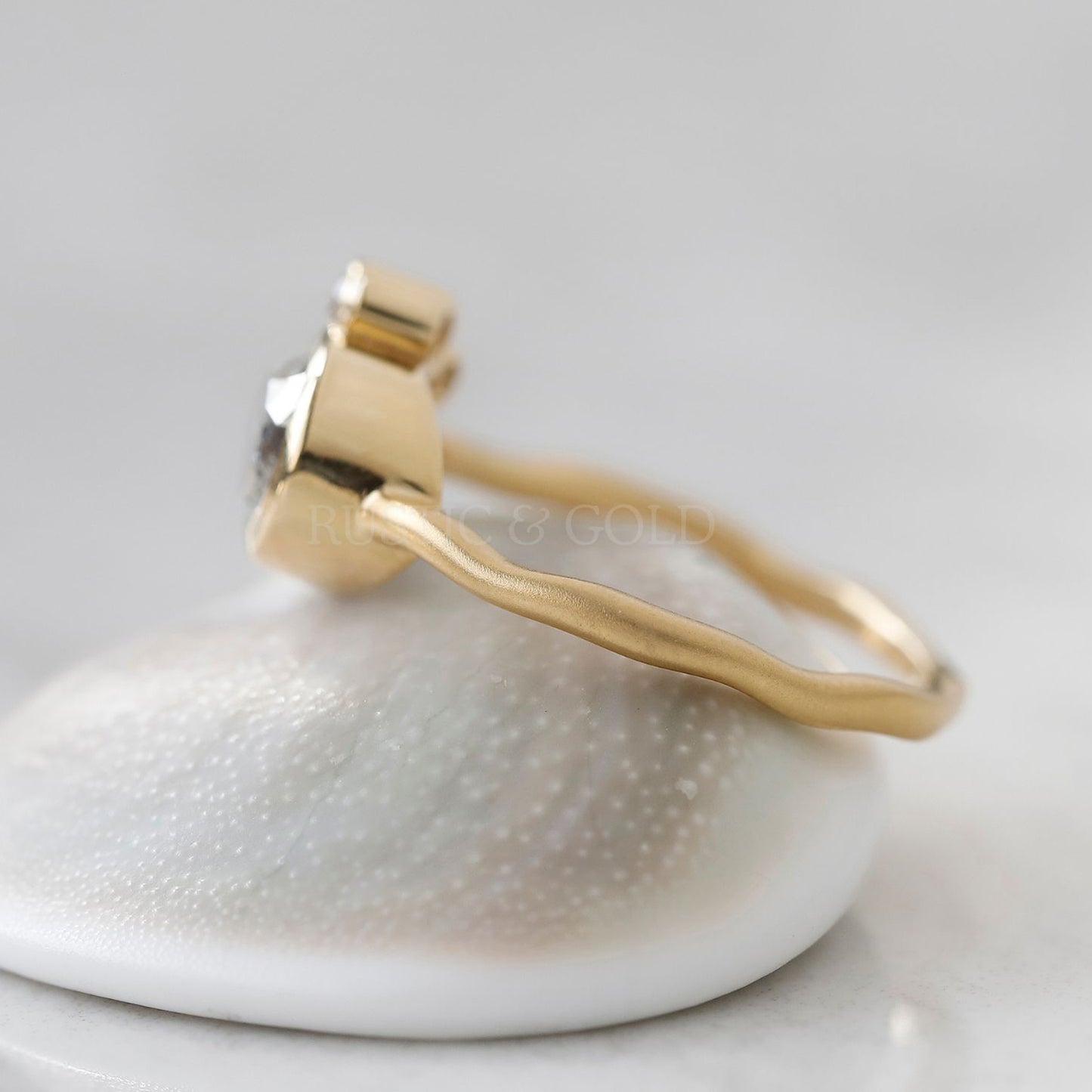 Artisan-crafted pear salt and pepper diamond ring with a unique sparkle
