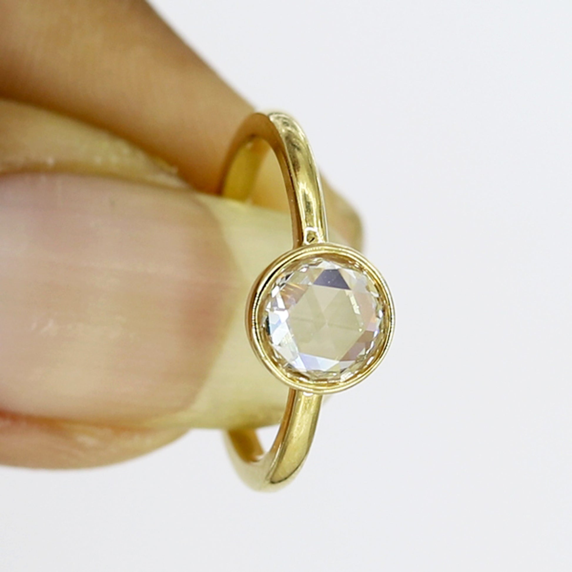 Handcrafted bezel set rose cut diamond ring with a sleek design