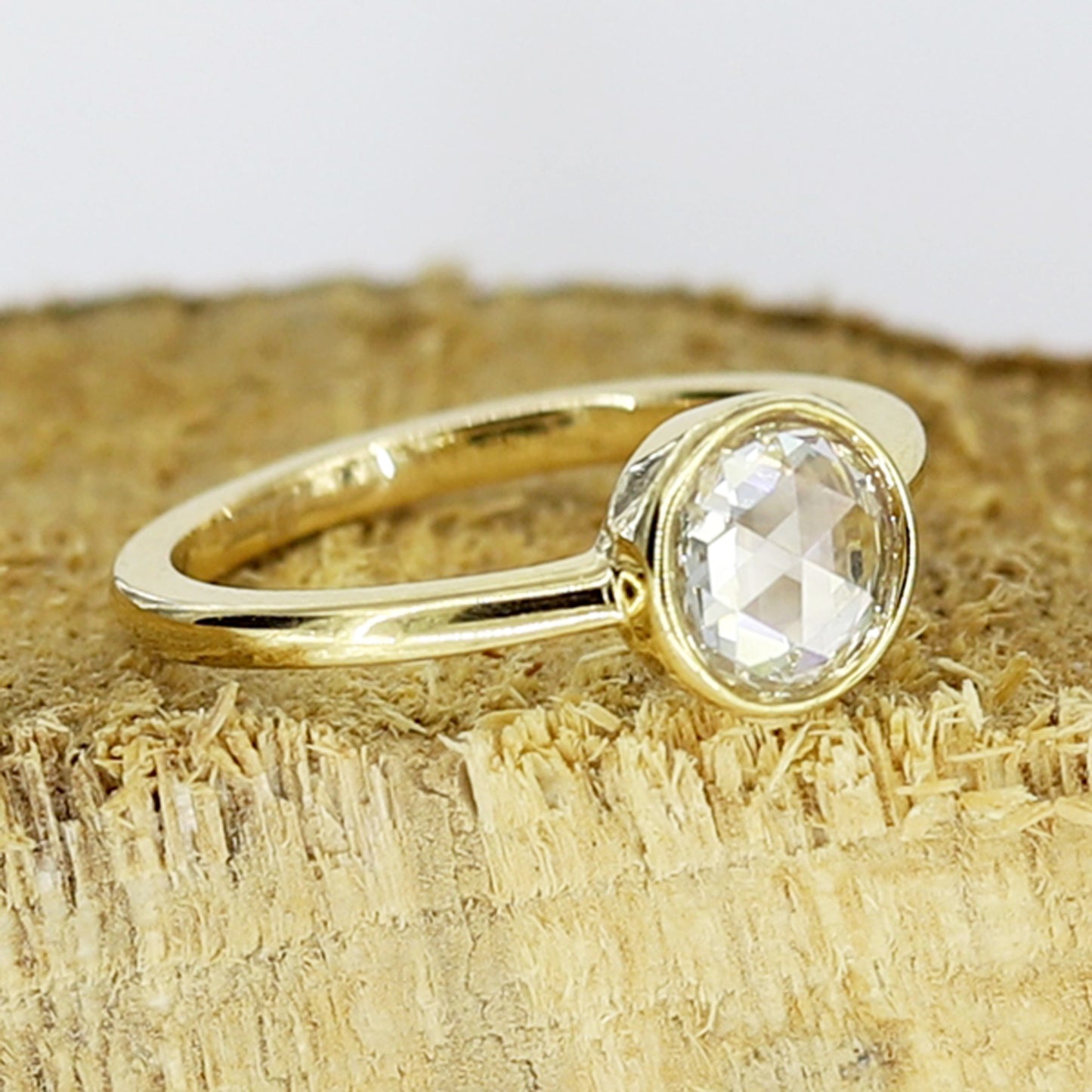 Unique bezel set rose cut diamond ring with a secure setting