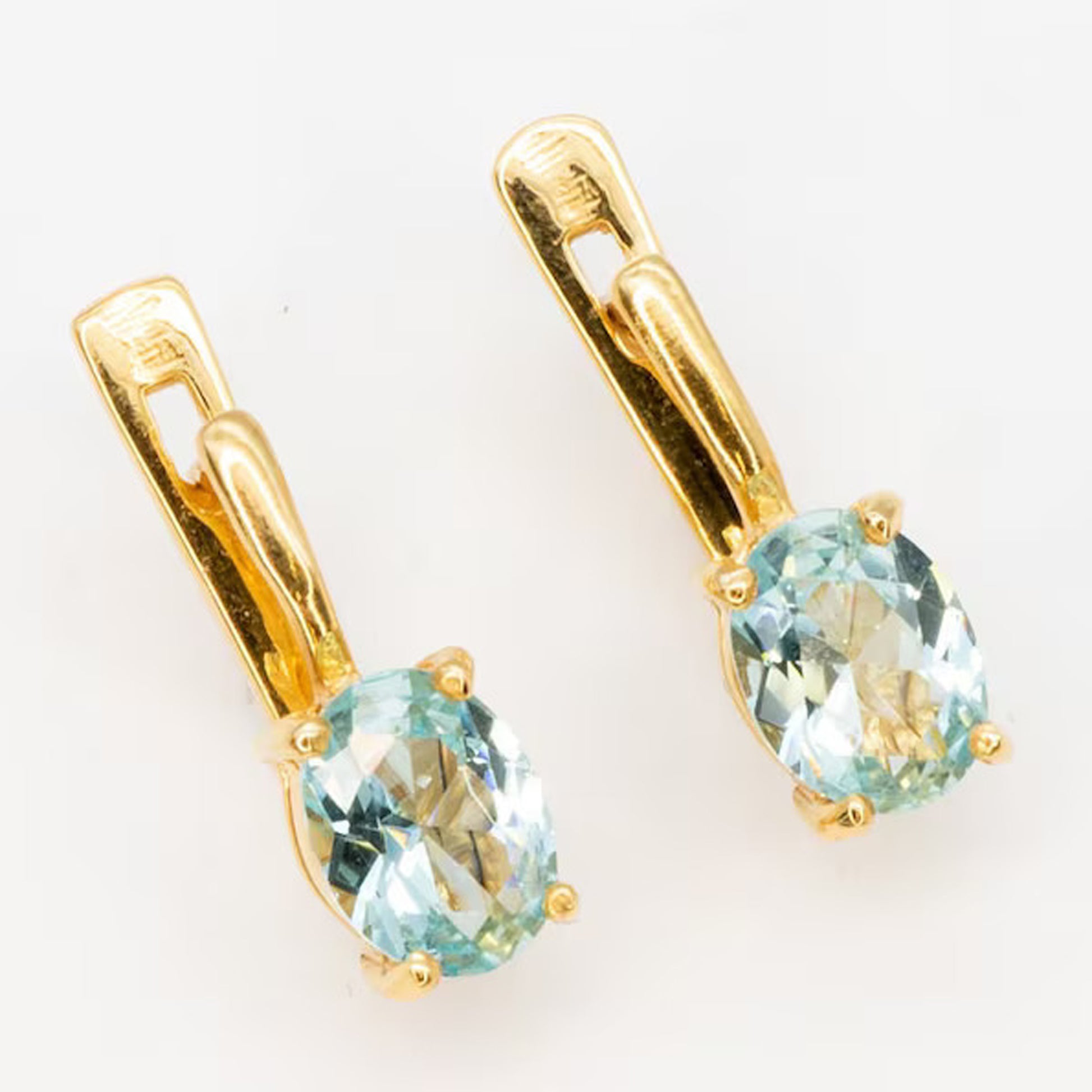 14K aquamarine earrings with oval cut gemstone