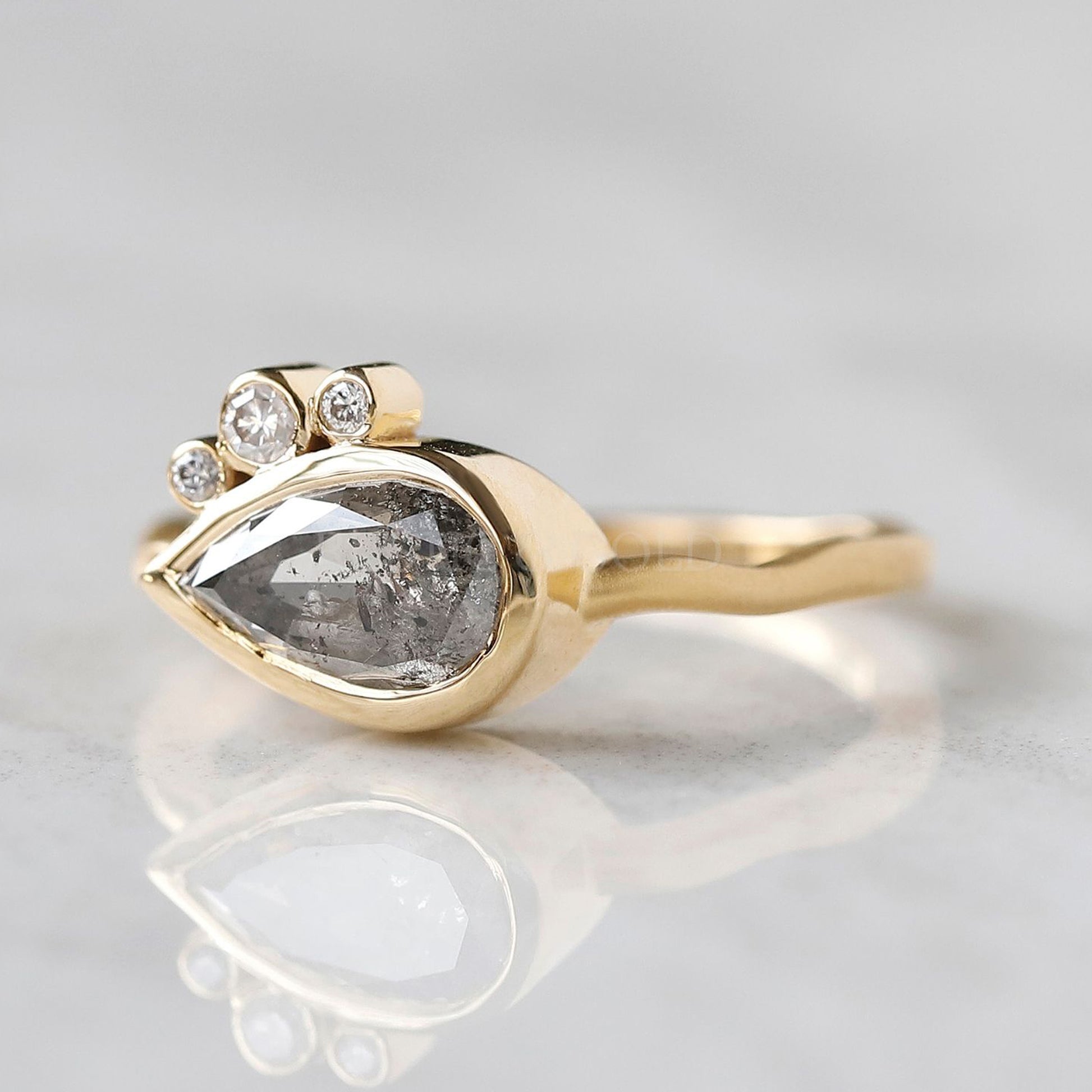 Modern pear salt and pepper diamond ring set in rose gold