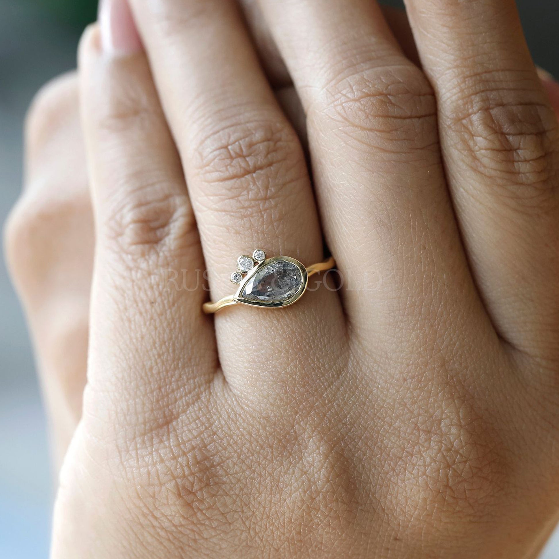 Timeless pear salt and pepper diamond ring perfect for engagements