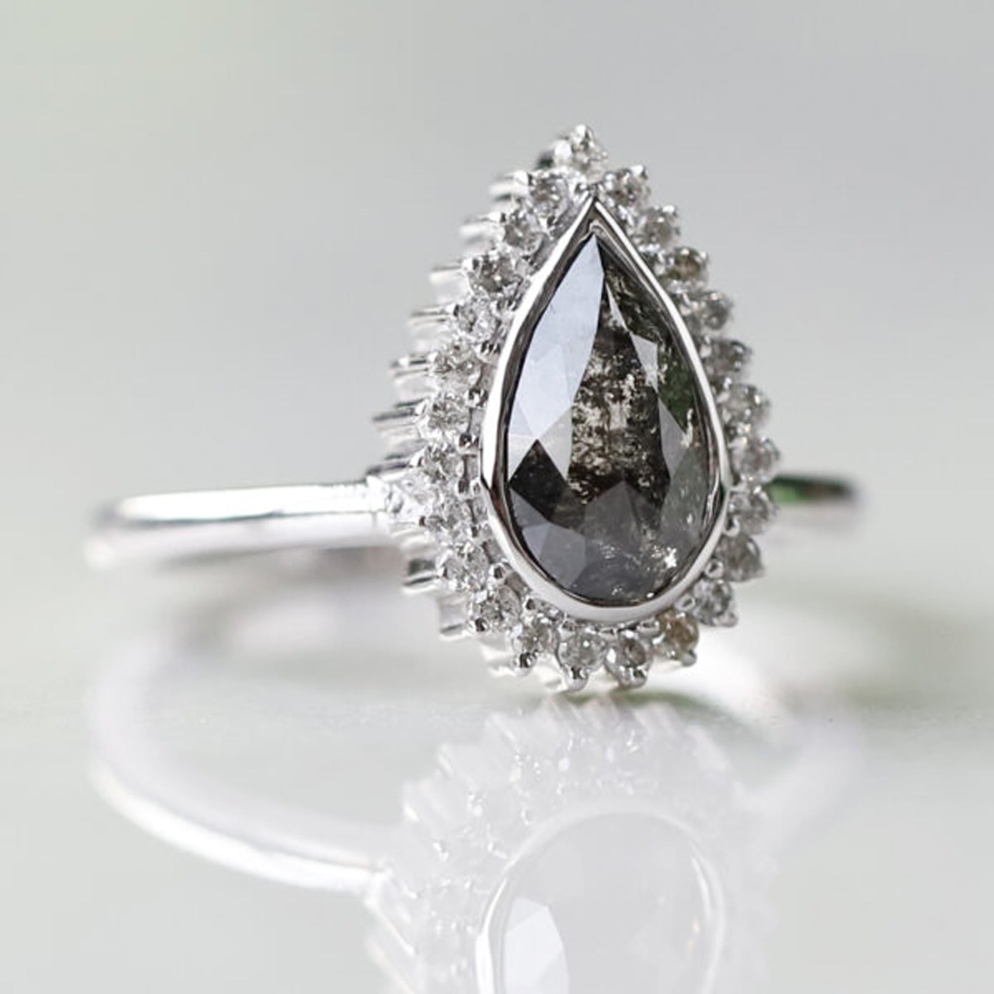 Custom pear shaped salt and pepper diamond ring