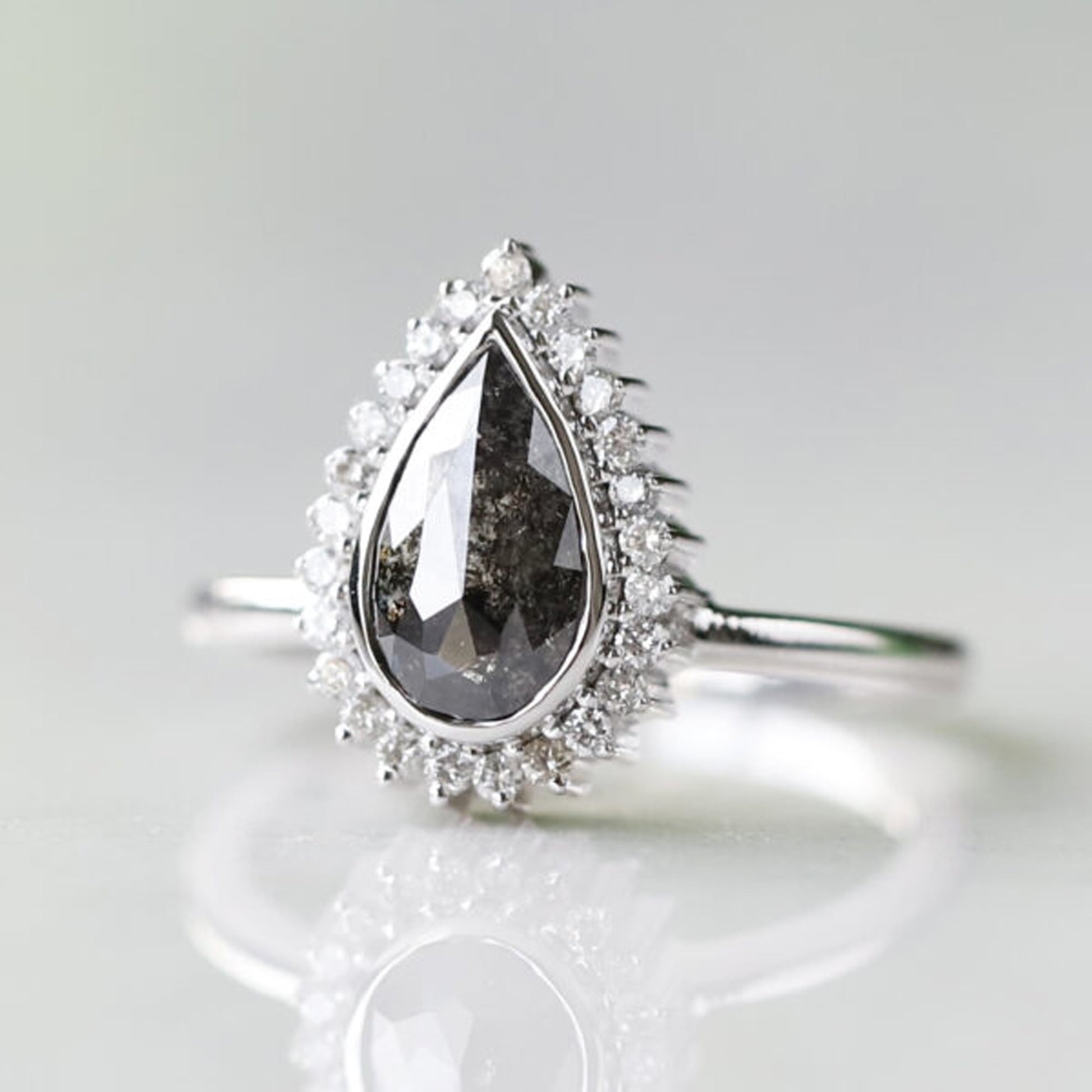 Beautiful pear shaped salt and pepper diamond ring design