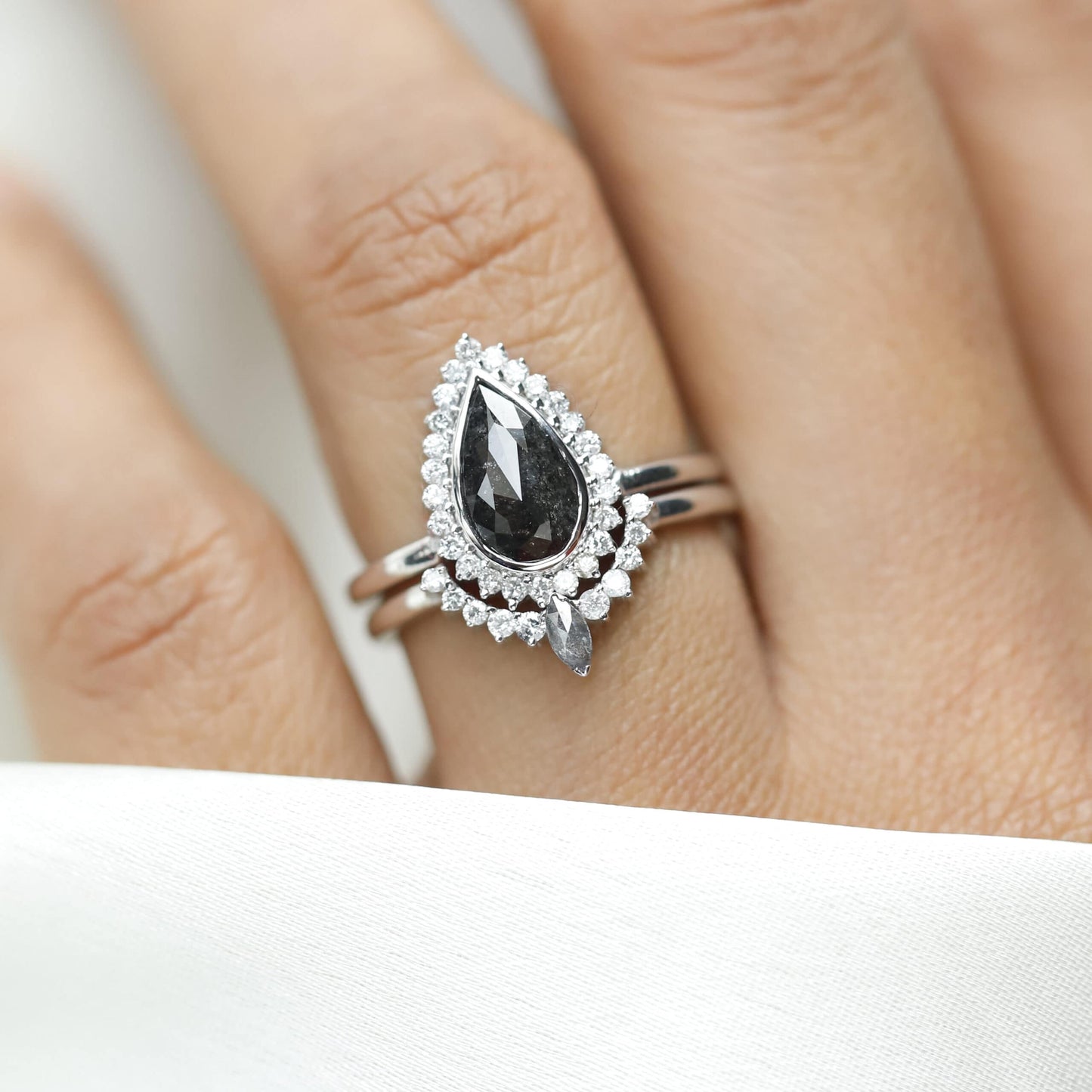 Luxury pear shaped salt and pepper diamond ring in 14k gold