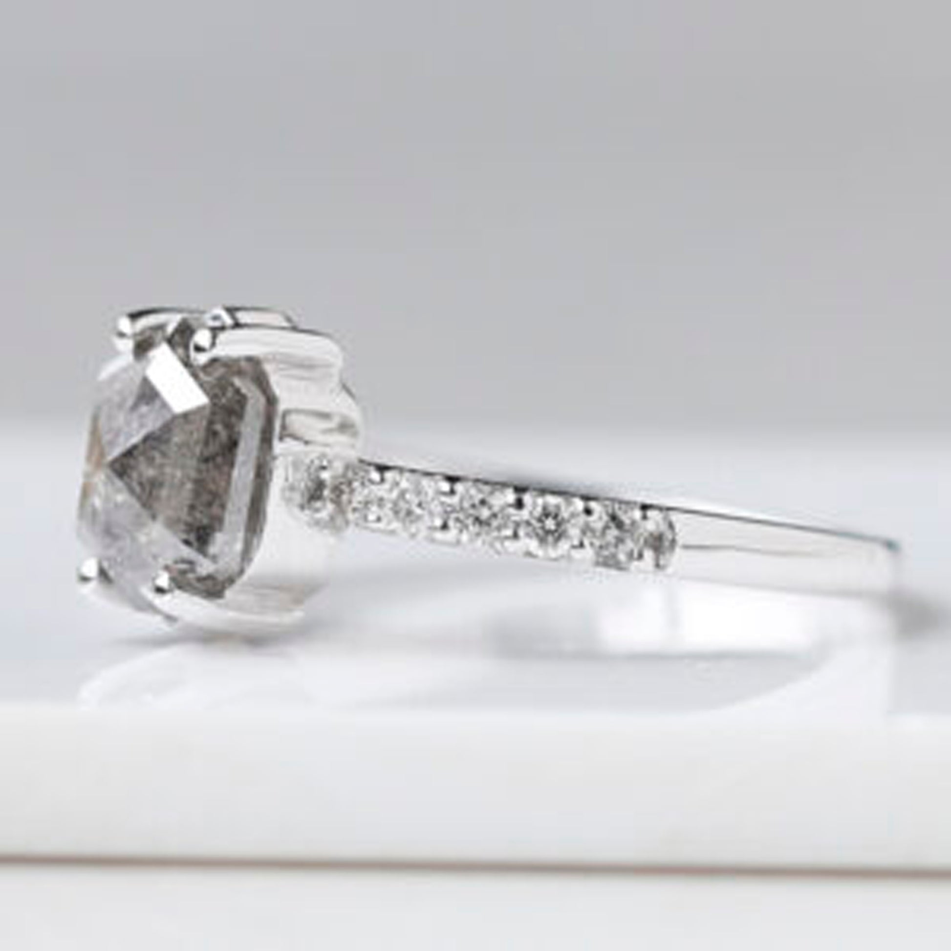 Unique salt and pepper hexagon engagement ring with intricate design