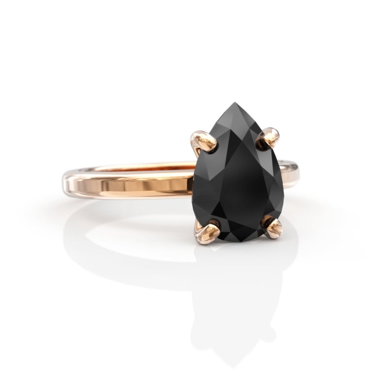 pear cut black diamond ring