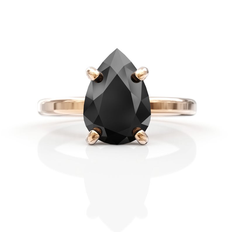 pear cut black diamond ring