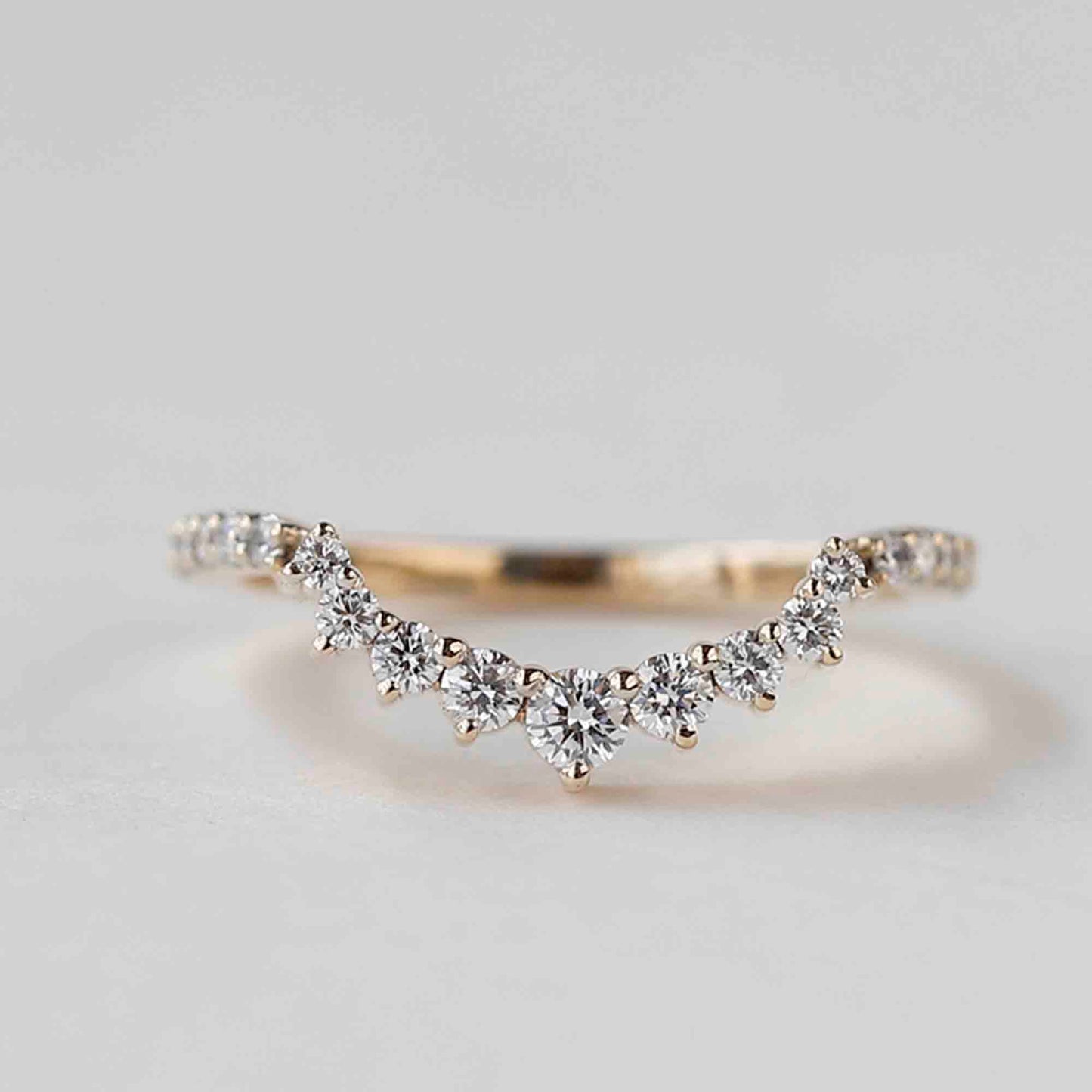 curved wedding band with engagement ring