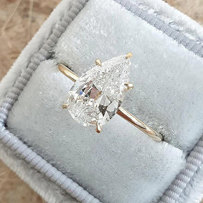 pear shaped moissanite engagement ring