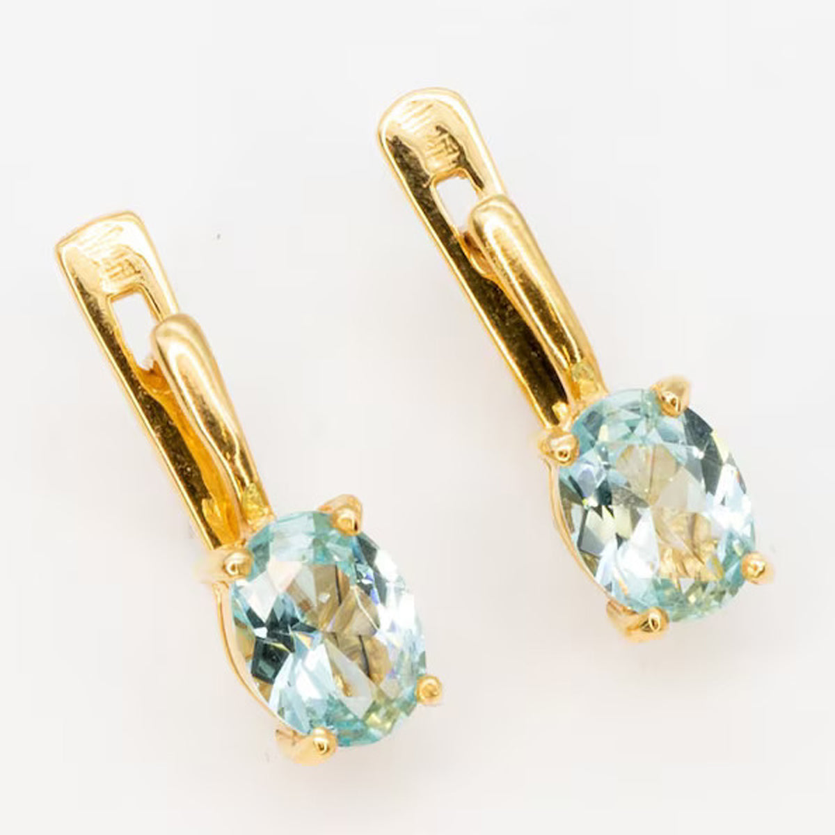 14K aquamarine earrings with oval cut gemstone
