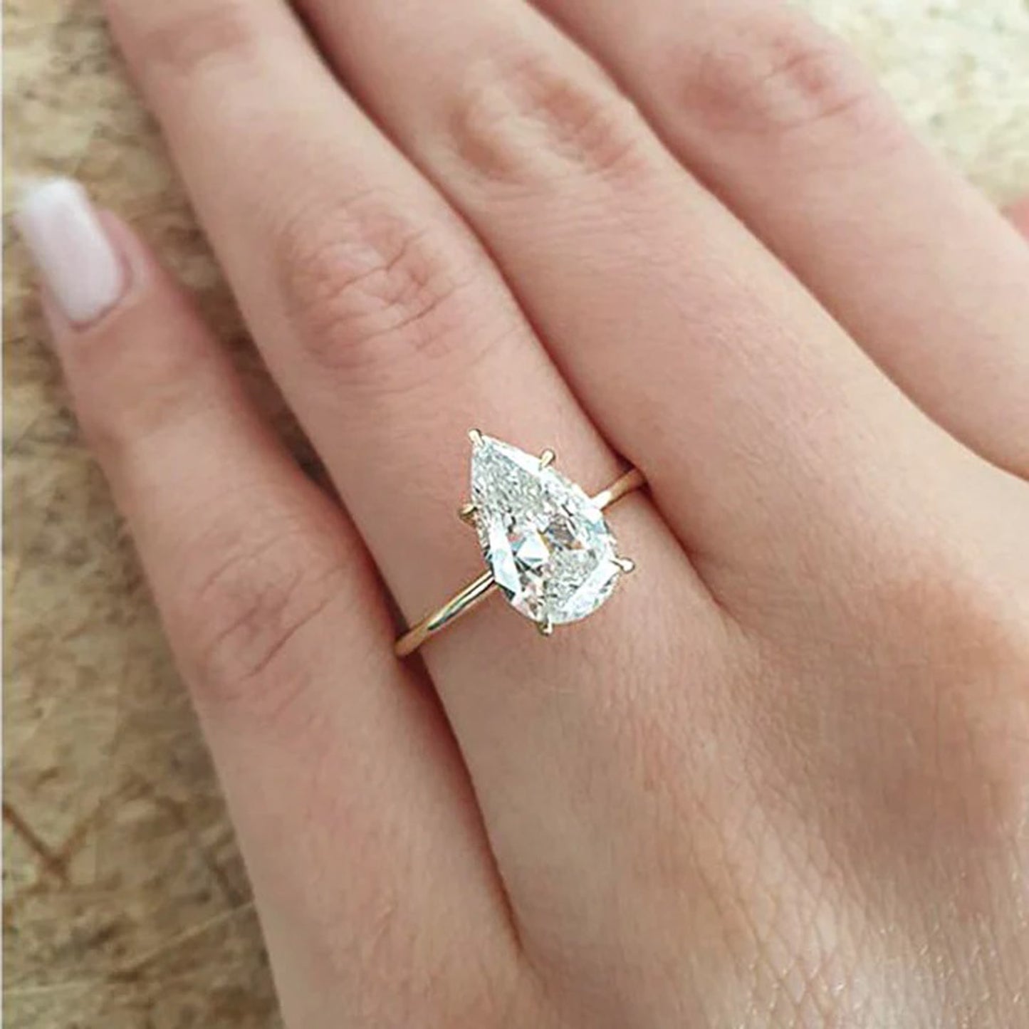 pear shaped moissanite engagement ring