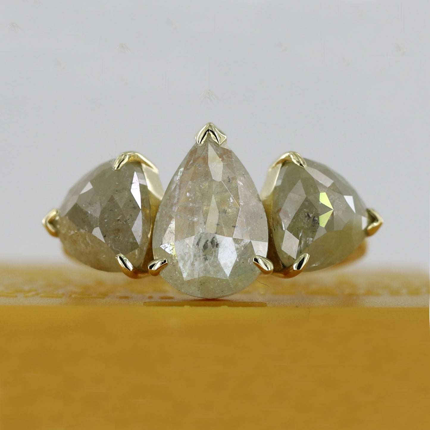 pear three stone ring