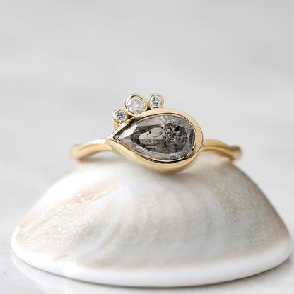 Handcrafted pear salt and pepper diamond ring with a rustic charm