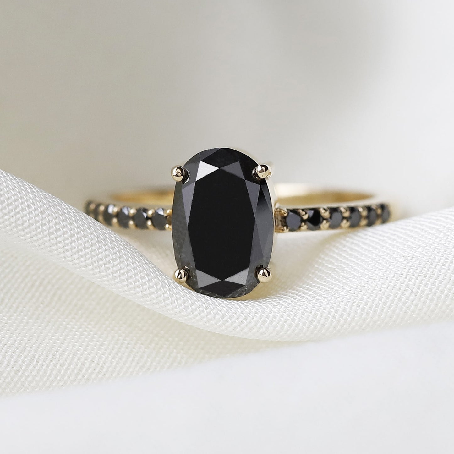 black oval diamond ring