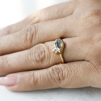 Elegant pear salt and pepper diamond ring in a gold setting