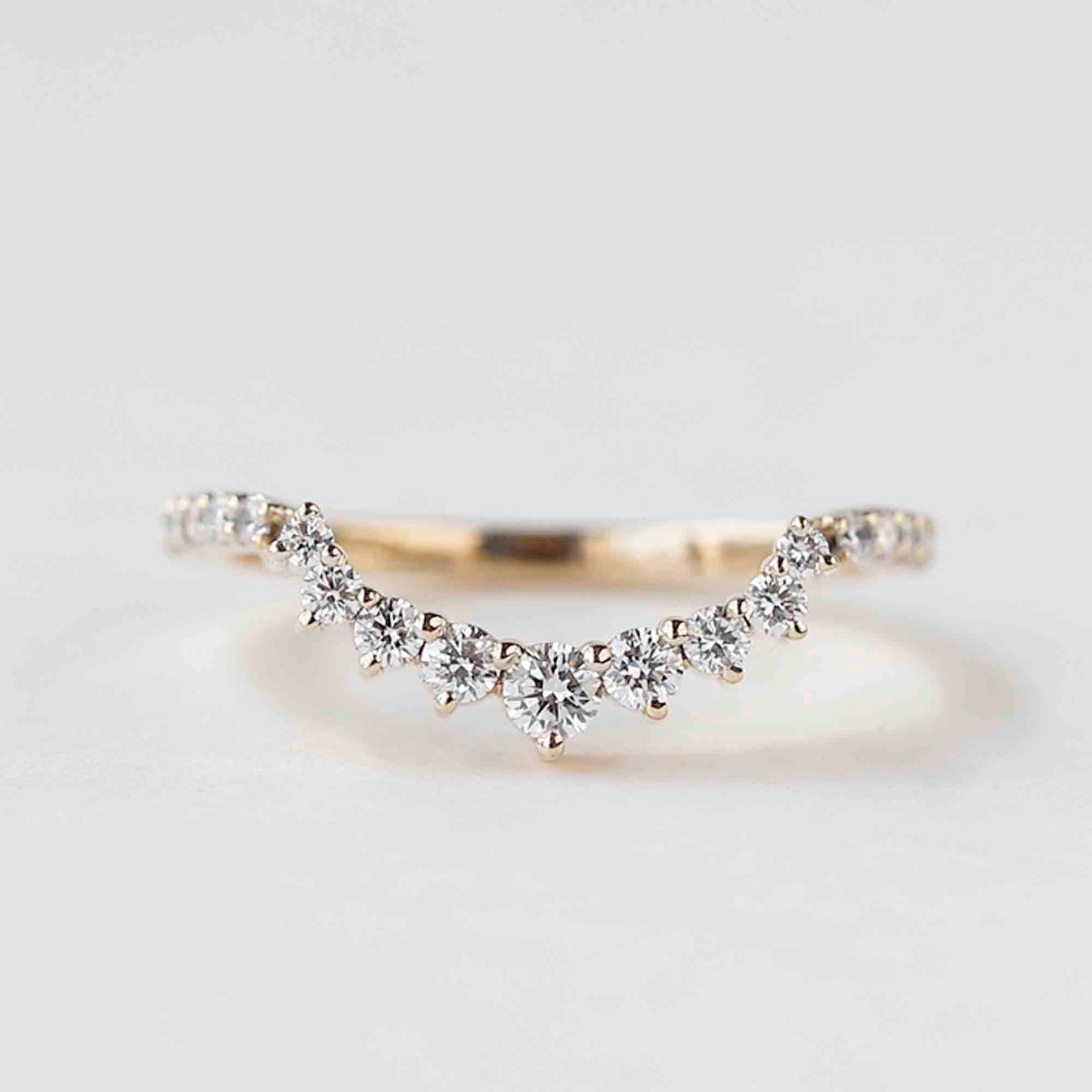 curved wedding band with engagement ring