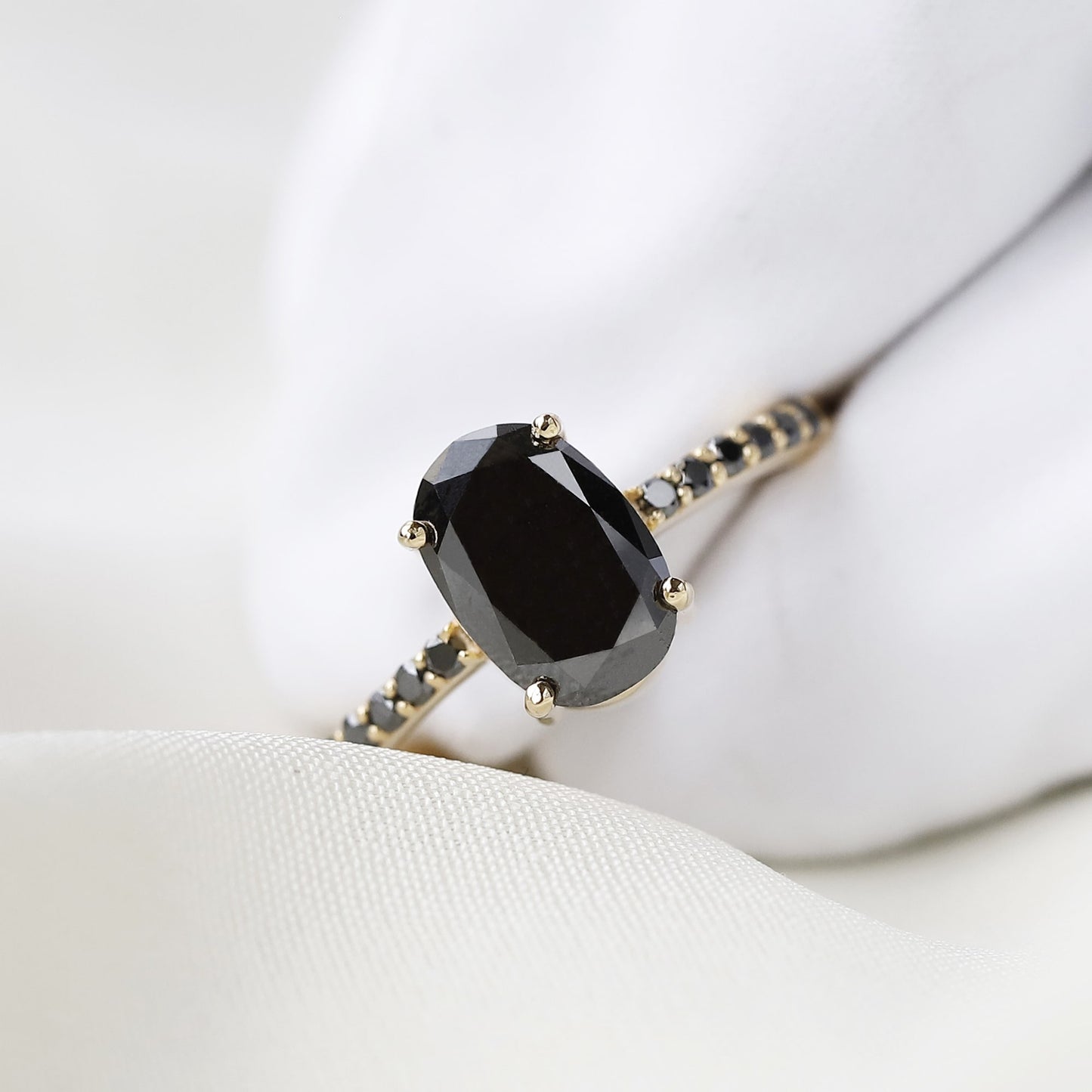 black oval diamond ring