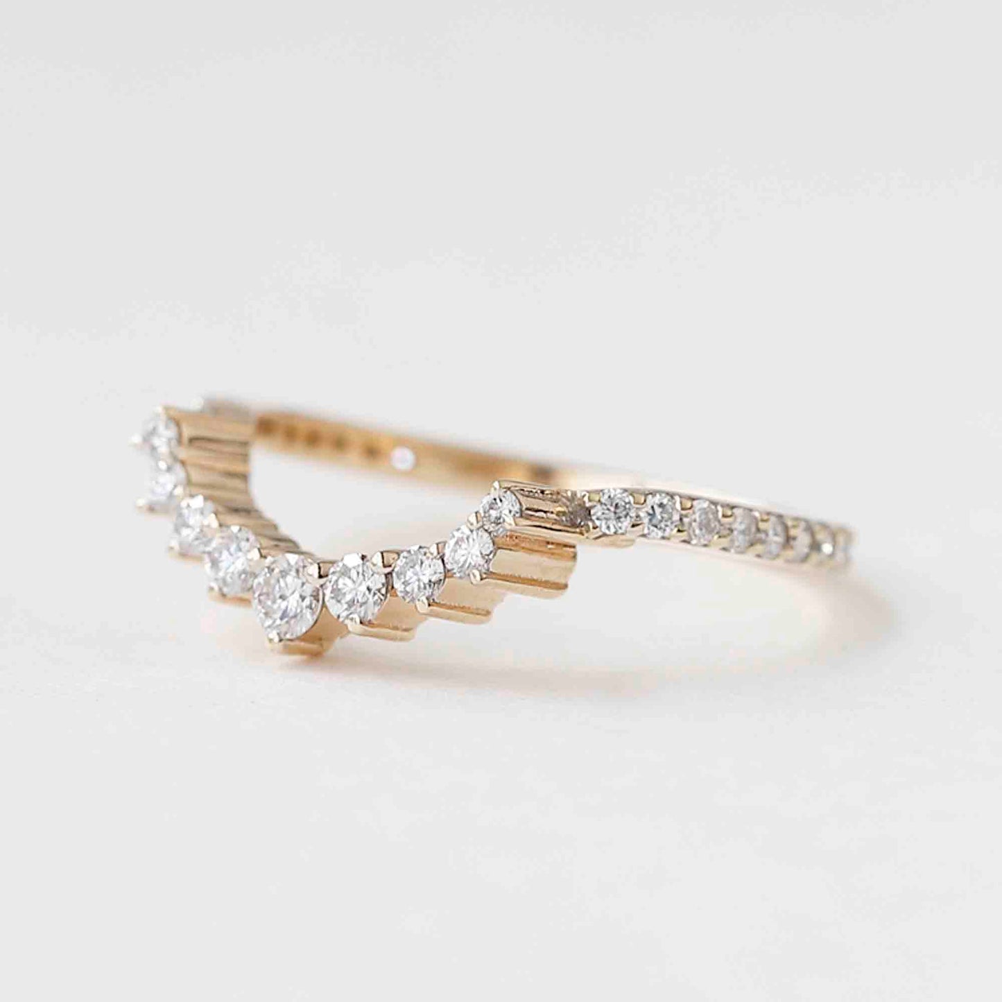 curved wedding band with engagement ring