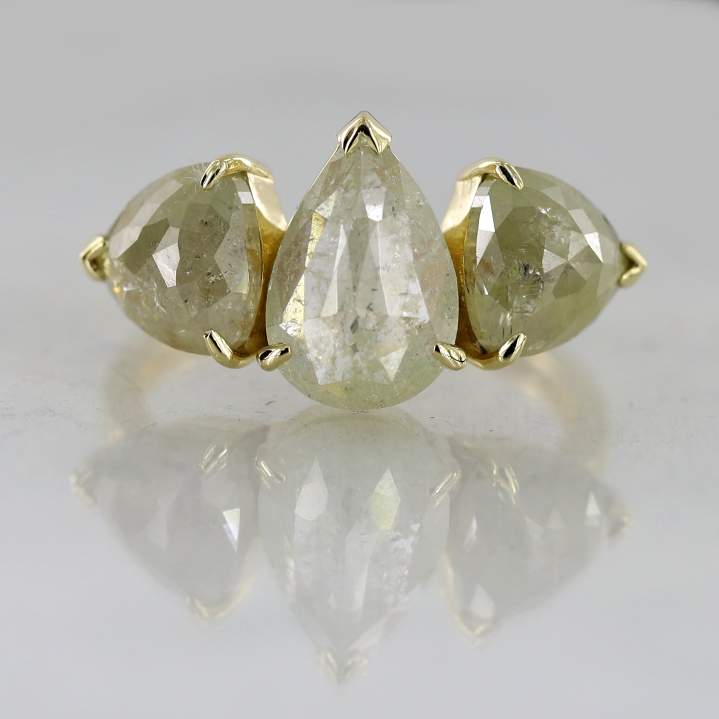 pear three stone ring